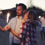 happy couple holding sparklers