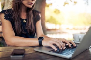 woman typing on a laptop