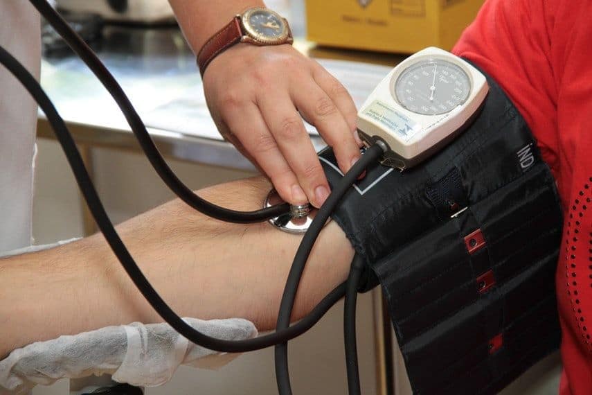 person having blood pressure checked
