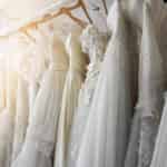 wedding dresses hanging on a rack
