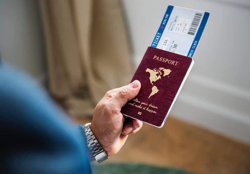 Travel Budget: Man Holding Passport