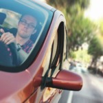 man thinking about buying vs leasing a car