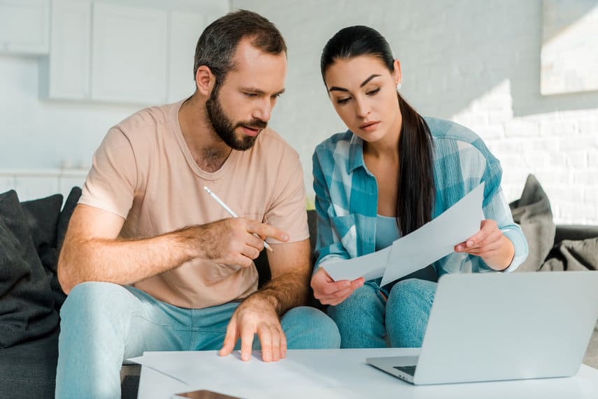 couple reviewing bank statements