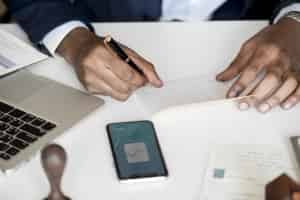 man writing a check