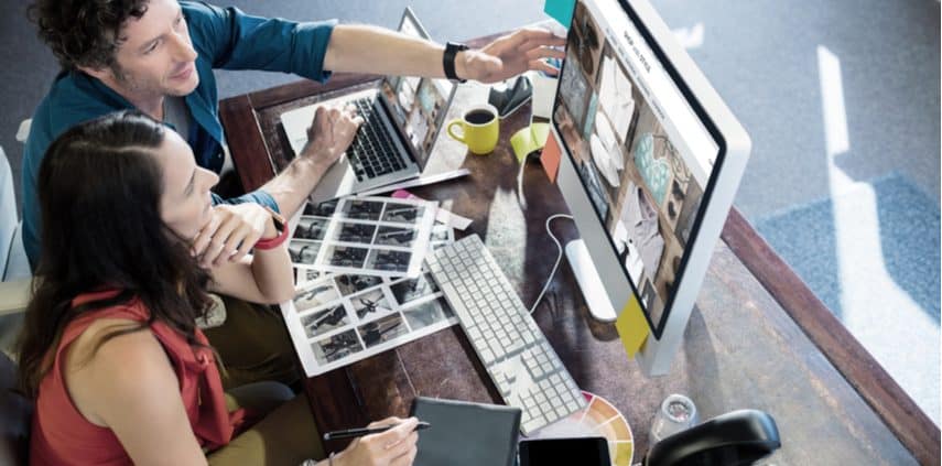 Man and woman selling stock photos online