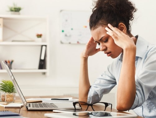 woman frustrated from living paycheck to paycheck