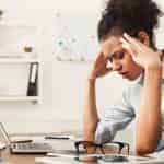 woman frustrated from living paycheck to paycheck