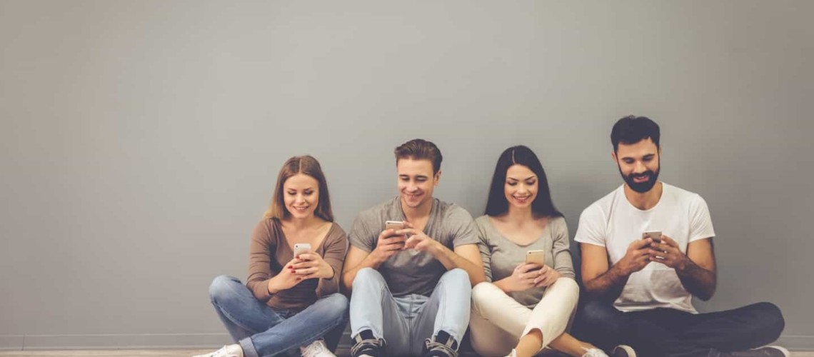 group of young micro investors using investing apps