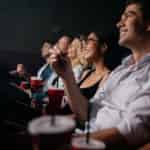 group of people watching movie in a theater