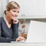 woman researching side hustles online