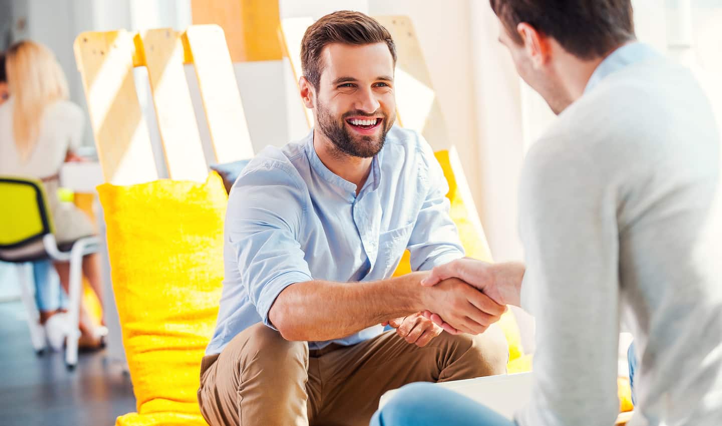 two men shaking hands