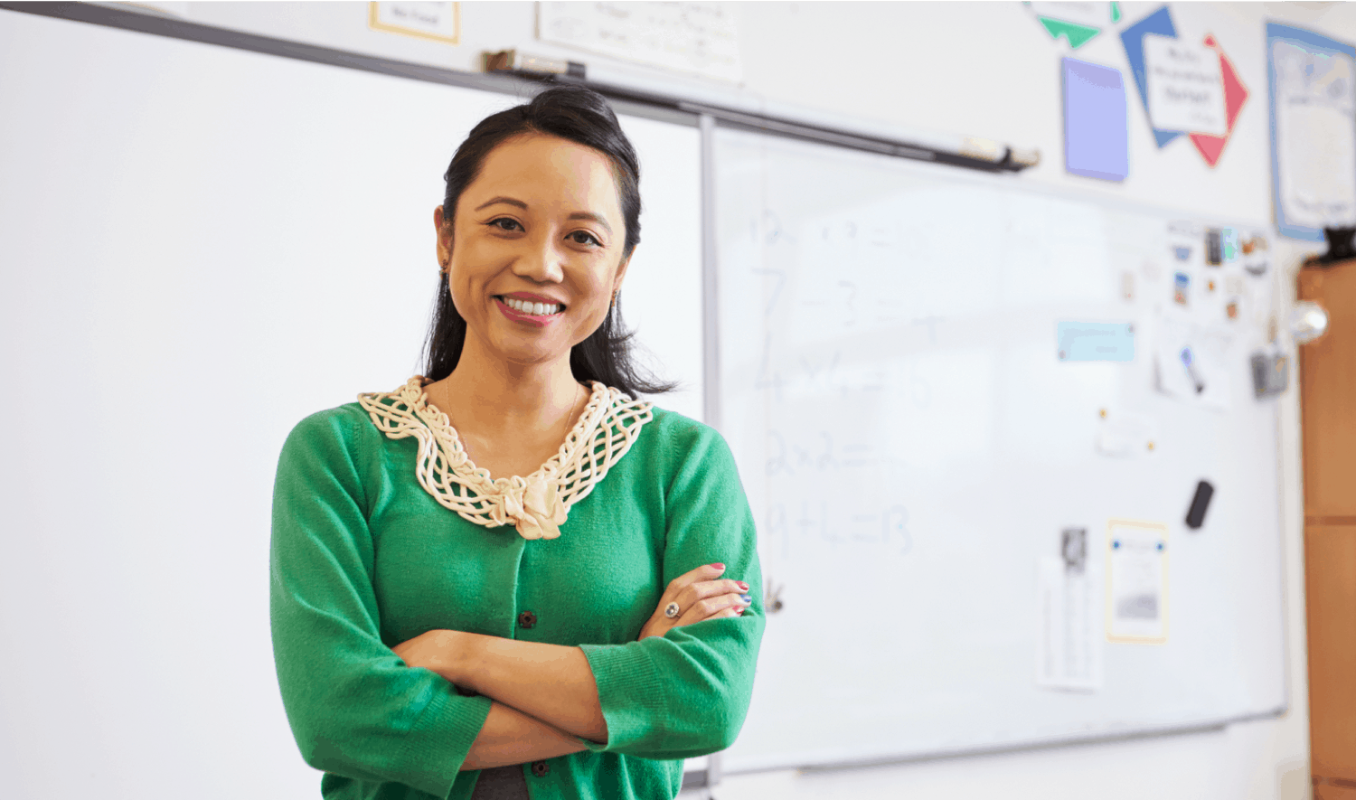 teacher in front of whiteboard