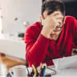 man contemplating holiday debt