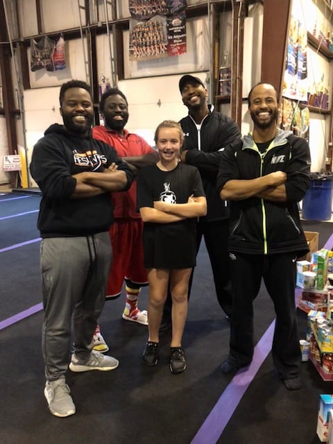 cheerleading coaches posing for photo