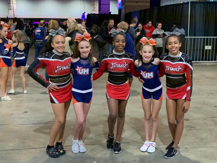 young cheerleaders smiling