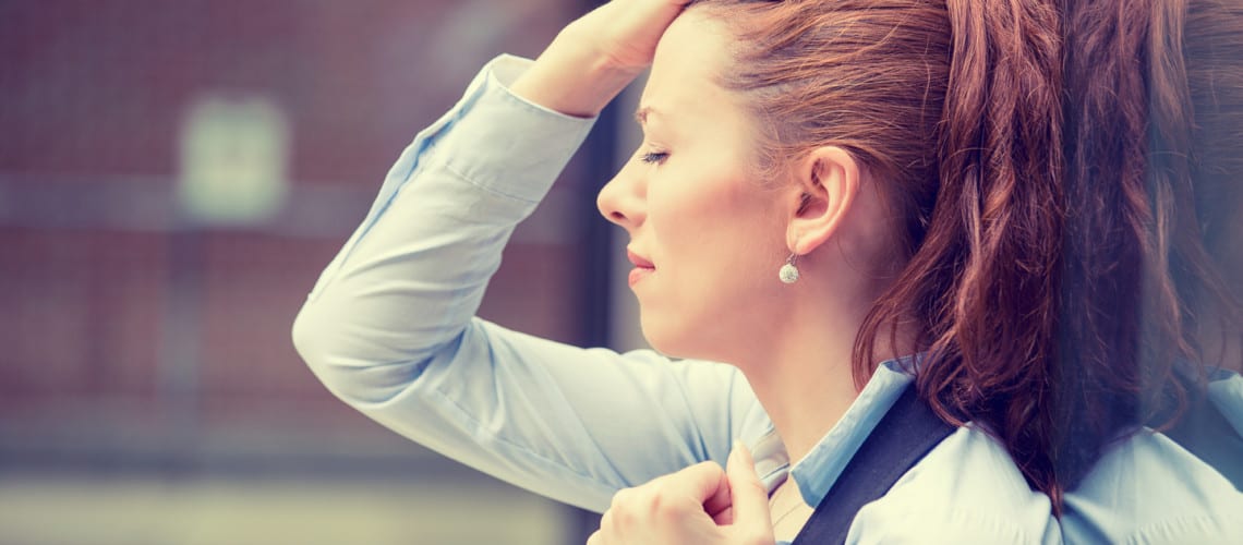 frustrated woman outside of workplace
