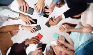 group of people holding smartphones using data collection apps