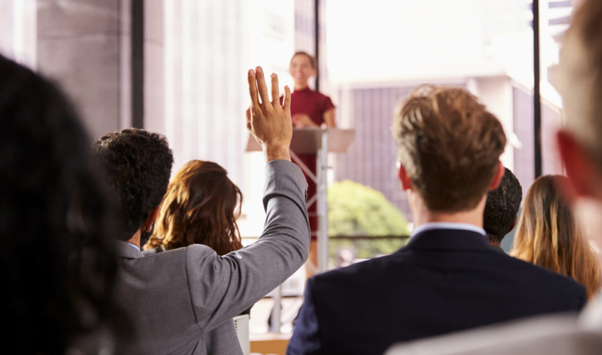 man asking question at work