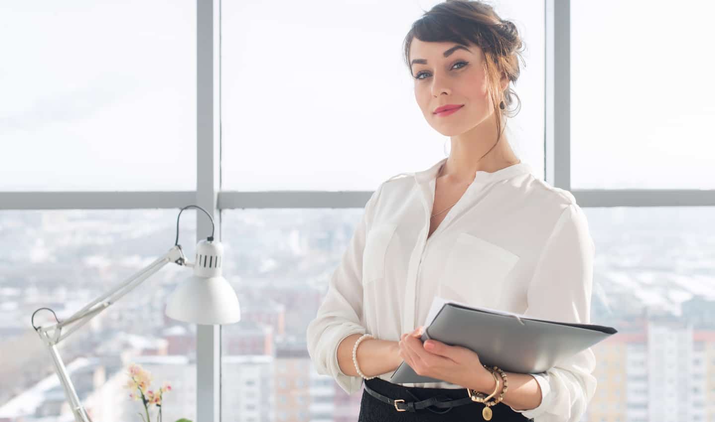 woman standing confidently at work