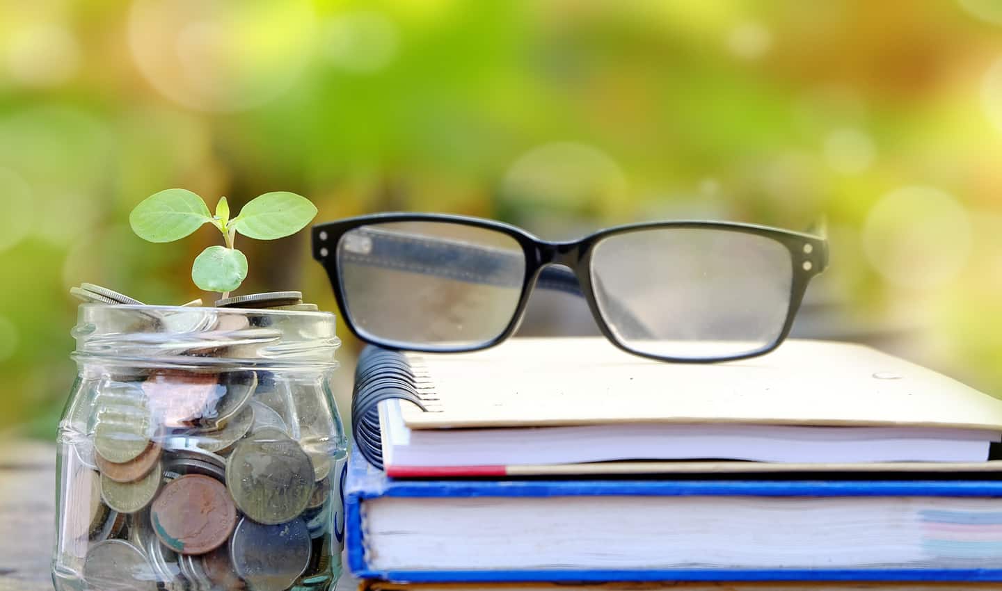 books glasses and coins