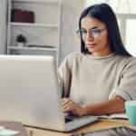 woman working from home researching blog post ideas