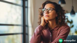 A woman wearing glasses and looking up and away, wondering how many bank accounts she should have.