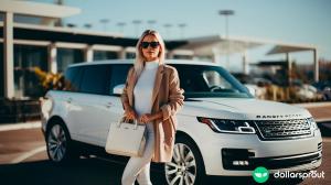 A well-dressed woman in designer clothing standing in front of her white Range Rover.
