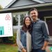 A husband and wife standing in front of their rental property that they use for Airbnb. There is an earnings screenshot showing their an overview of their revenue history.