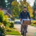 A man riding his bike and delivering food via a delivery app.