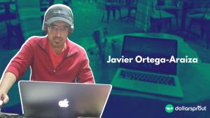 Photo of Javier Ortega-Araiza working on his laptop with headphones on.