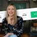 Emily Odio-Sutton smiling in front of her Etsy revenue dashboard showing over 20K orders and $533K in revenue