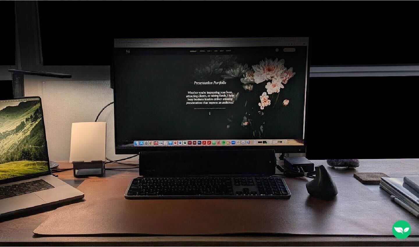 Linda Tran’s workspace, featuring a dual-monitor setup with her presentation portfolio displayed on screen and a clean, minimalist desk layout.