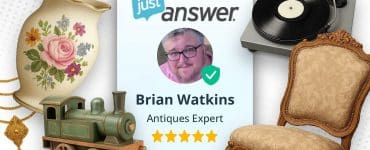 Illustration showing Brian Watkins, an antiques expert on JustAnswer, surrounded by vintage collectibles including a record player, ornate chair, toy train, floral vase, and gold pendant — representing how he earns money appraising items online.