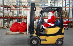 Man dressed as Santa driving a forklift