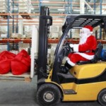 Man dressed as Santa driving a forklift