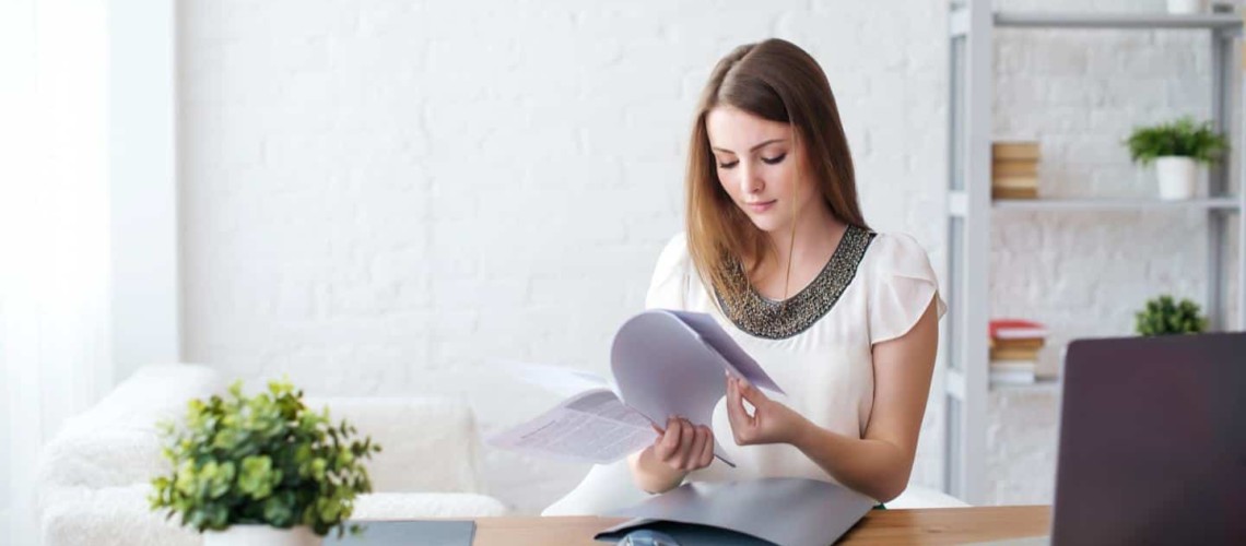 woman reading papers
